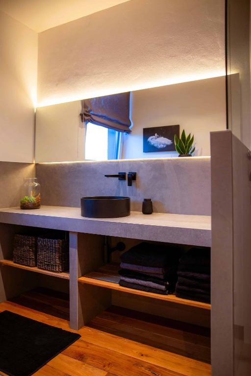 a bathroom with a sink and a counter with towels at N6Quartier in Bad Münstereifel