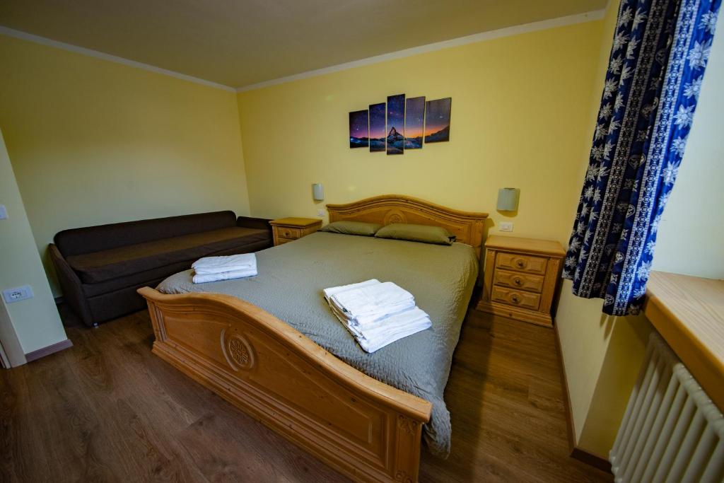 En eller flere senge i et værelse på Appartamento Ofelia