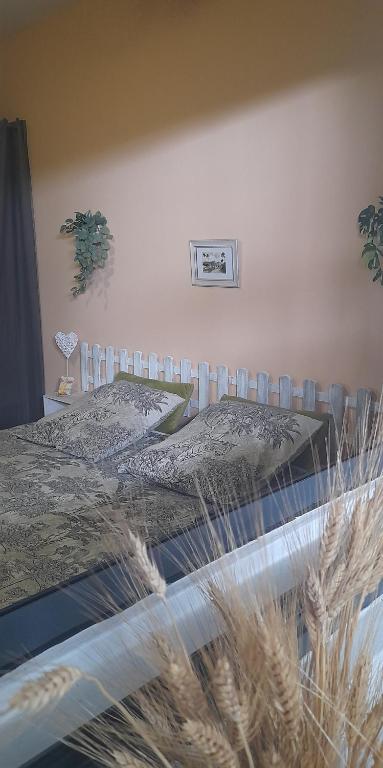 a bedroom with a bed and a air conditioner on the wall at Chambre diamants in Saint-Pierre