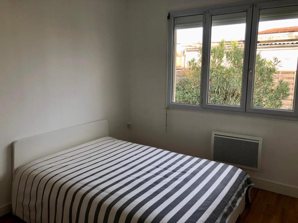 Posteľ alebo postele v izbe v ubytovaní Maison plain-pied Tarbes