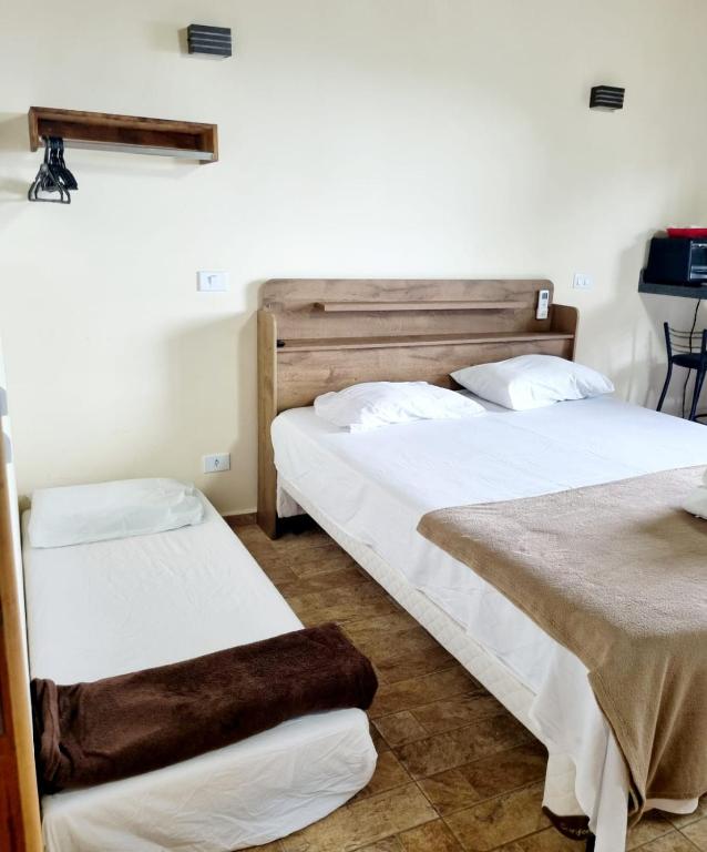Burung Flats Itamambuca - Hospedagem com vista para o marにあるベッド