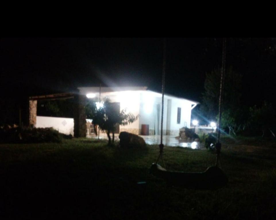 a house at night with a swing in the yard at Villino Maria Vittoria in Castellammare del Golfo