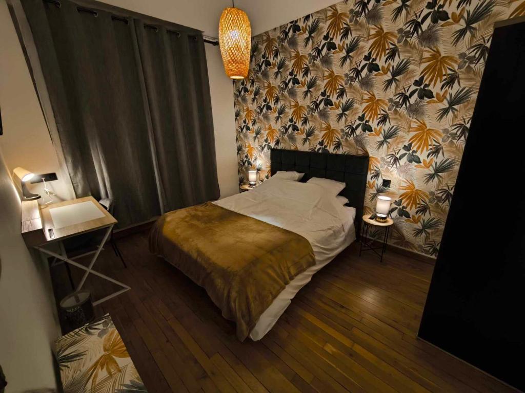 Ένα ή περισσότερα κρεβάτια σε δωμάτιο στο Atelier des Rêves