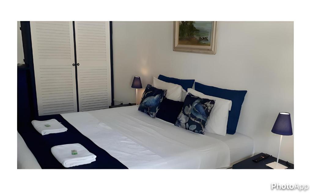 Ένα ή περισσότερα κρεβάτια σε δωμάτιο στο Pousada Mainá