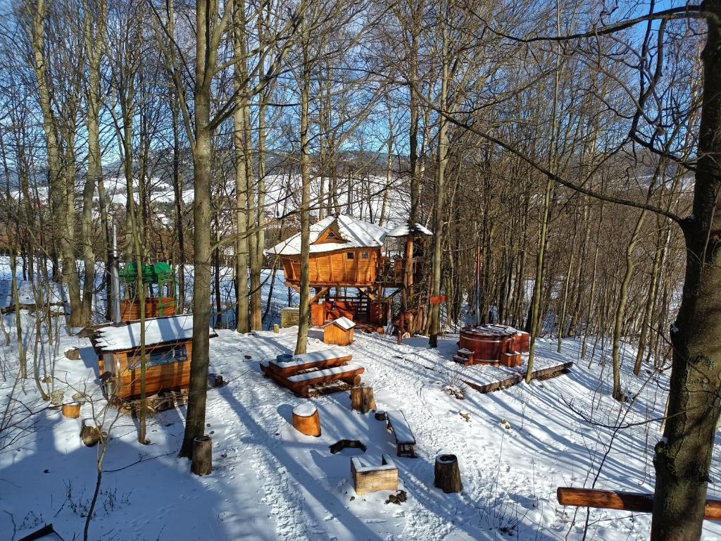 a tree house in the snow in the woods at Treehous Sněžník s wellness in Dolní Morava