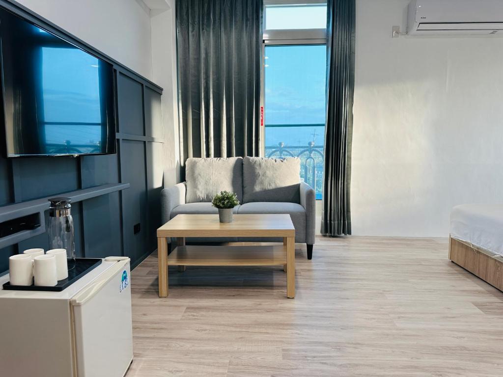 Posezení v ubytování Qing Taoyuan Homestay