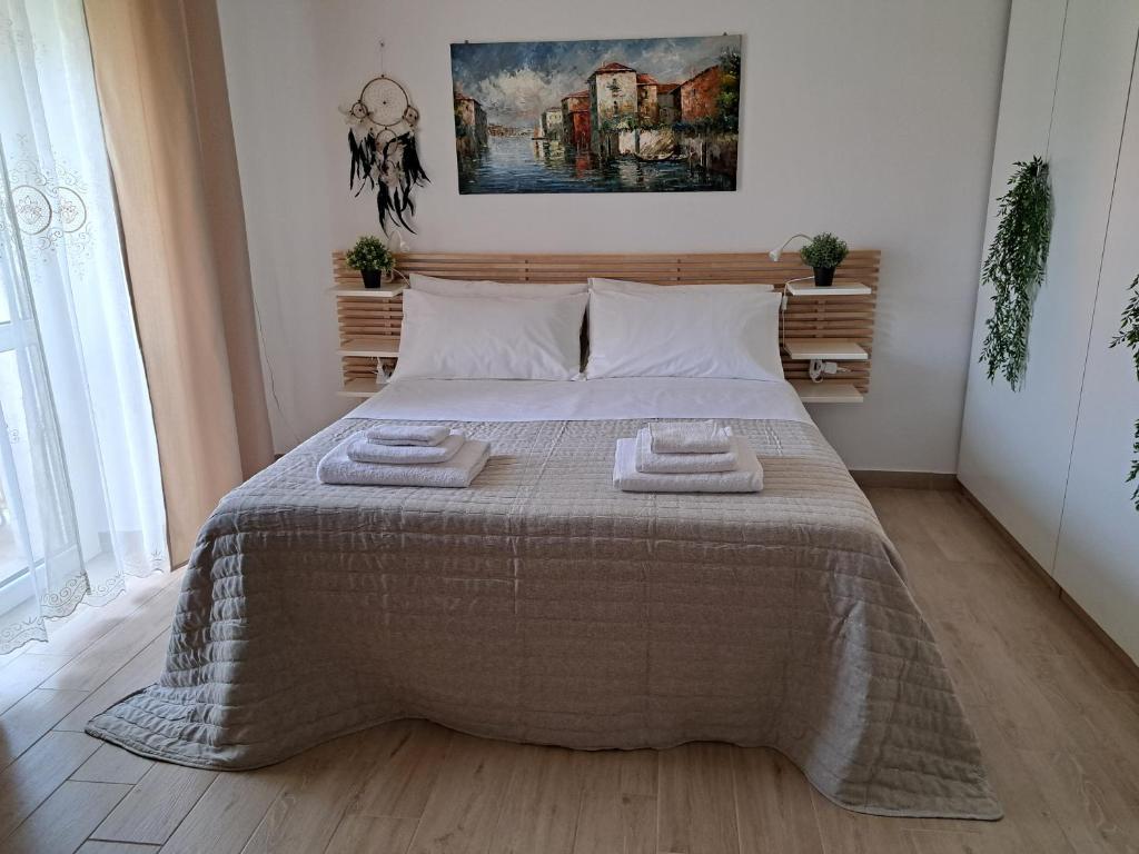 Postel nebo postele na pokoji v ubytování CAMERA DA TATIANA FIERA