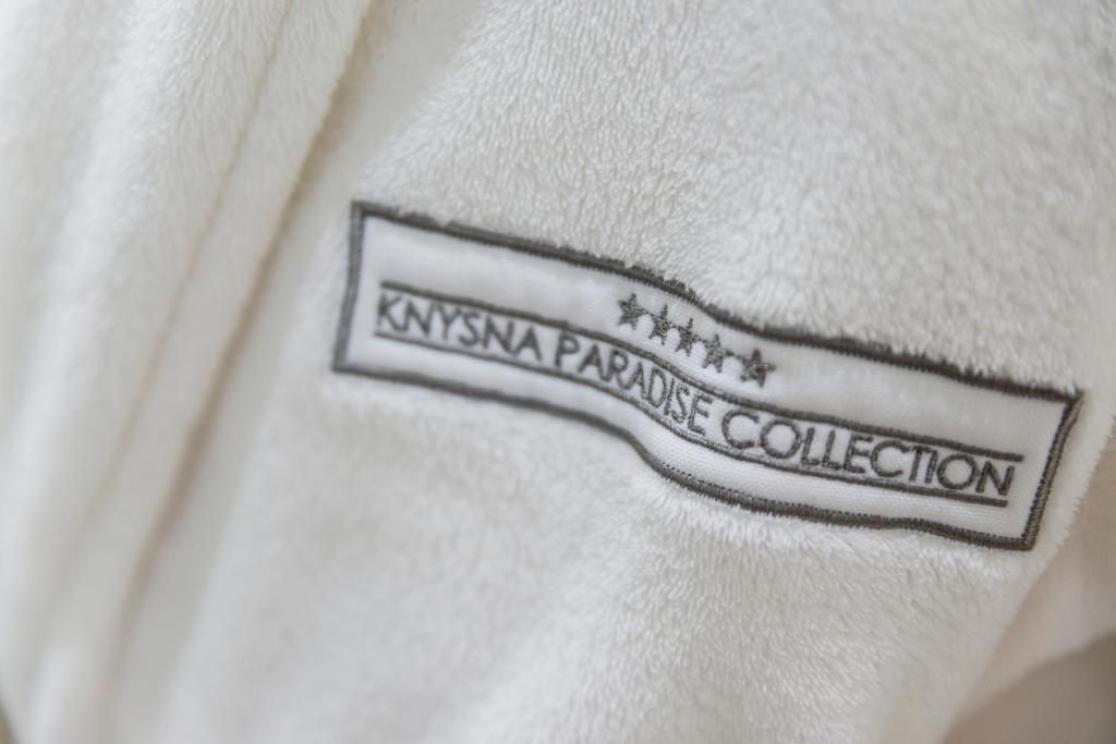 a close up of a label on a white shirt at THEBLOEM Guest Suites by Knysna Paradise Collection in Knysna