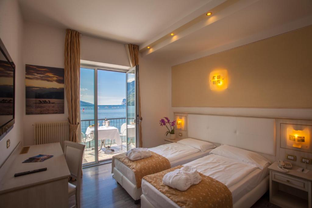 Postel nebo postele na pokoji v ubytování Hotel Lido Blu - Surf & Bike