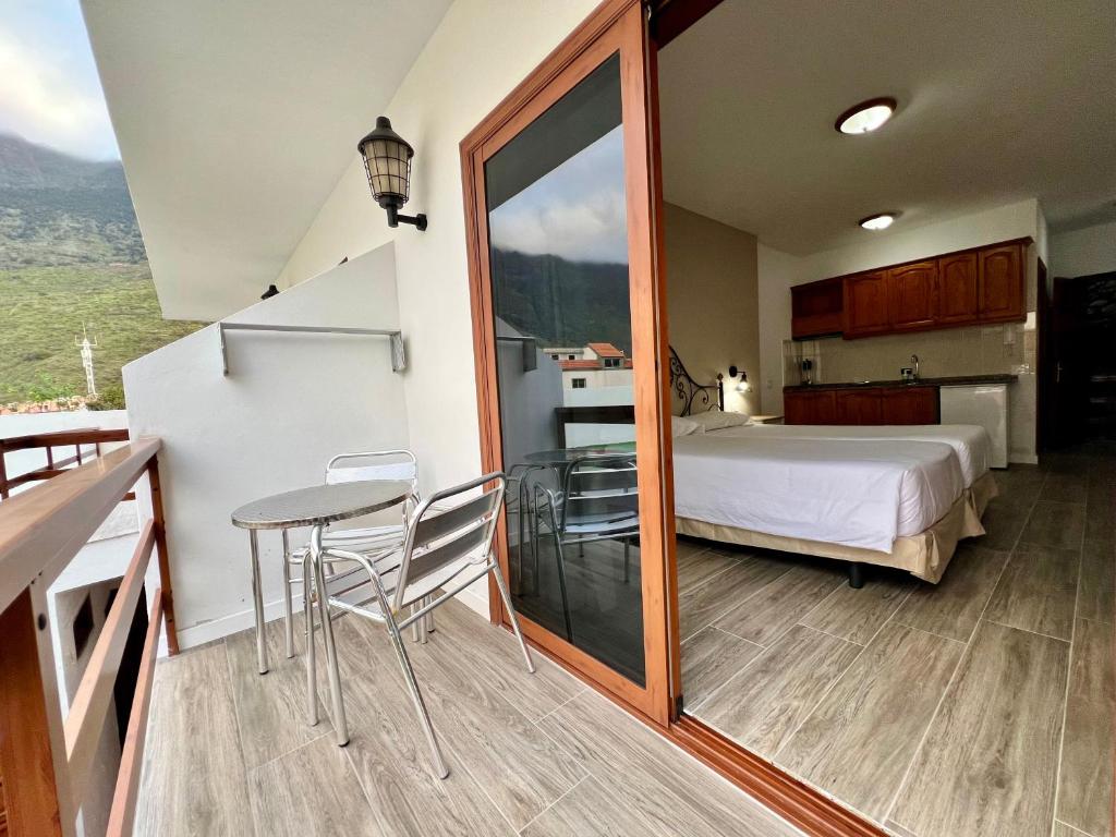 A bed or beds in a room at Apartamentos Frontera
