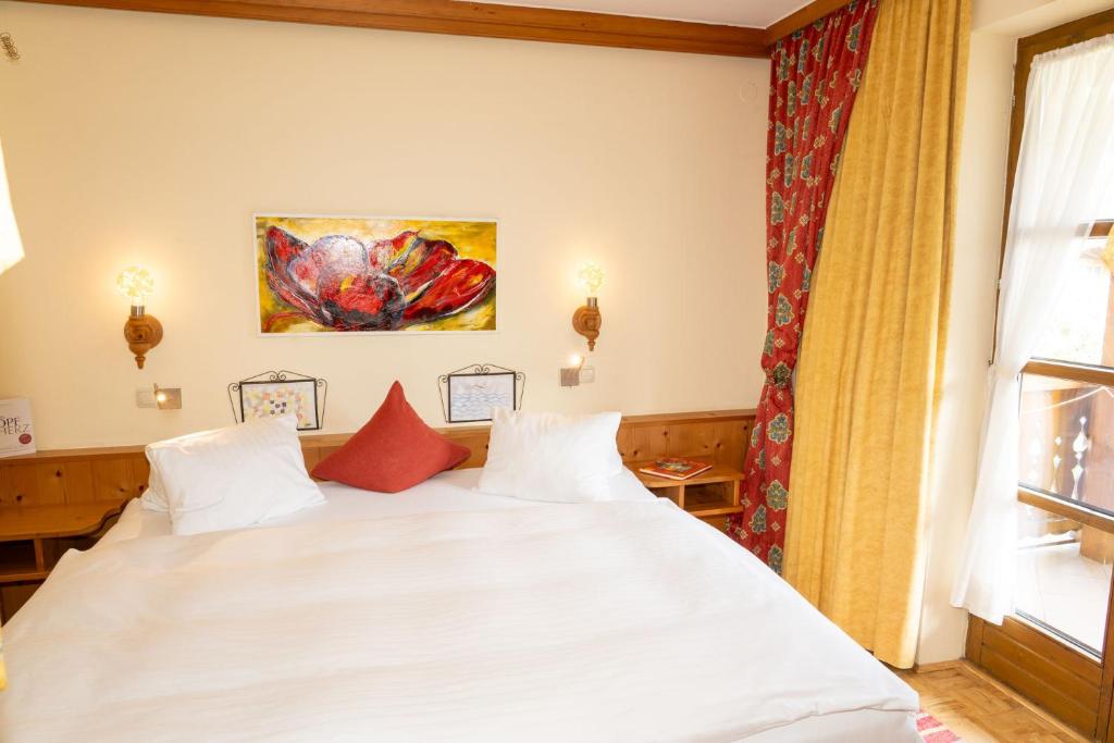 Posteľ alebo postele v izbe v ubytovaní Bauernhofhotel "die Unterbergerin" - Zimmer mit Frühstück und Ferienwohnungen in Gastein mit GRATIS Thermeneintritt