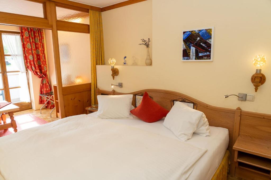 Posteľ alebo postele v izbe v ubytovaní Bauernhofhotel "die Unterbergerin" - Zimmer mit Frühstück und Ferienwohnungen in Gastein mit GRATIS Thermeneintritt