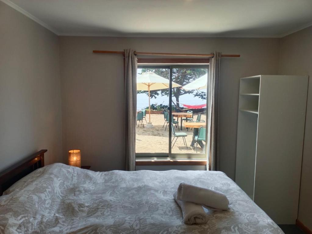 Postel nebo postele na pokoji v ubytování Hostal Quiriyuca Sur