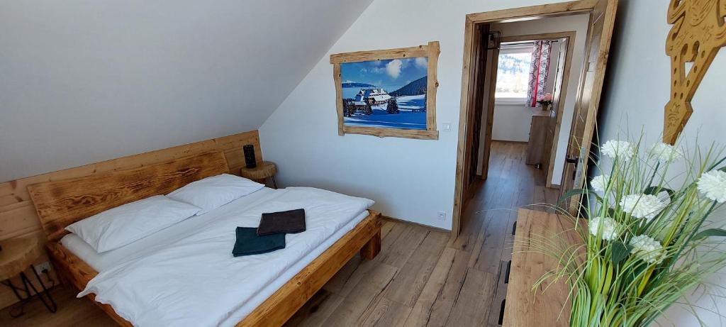 Postel nebo postele na pokoji v ubytování Rajderówka