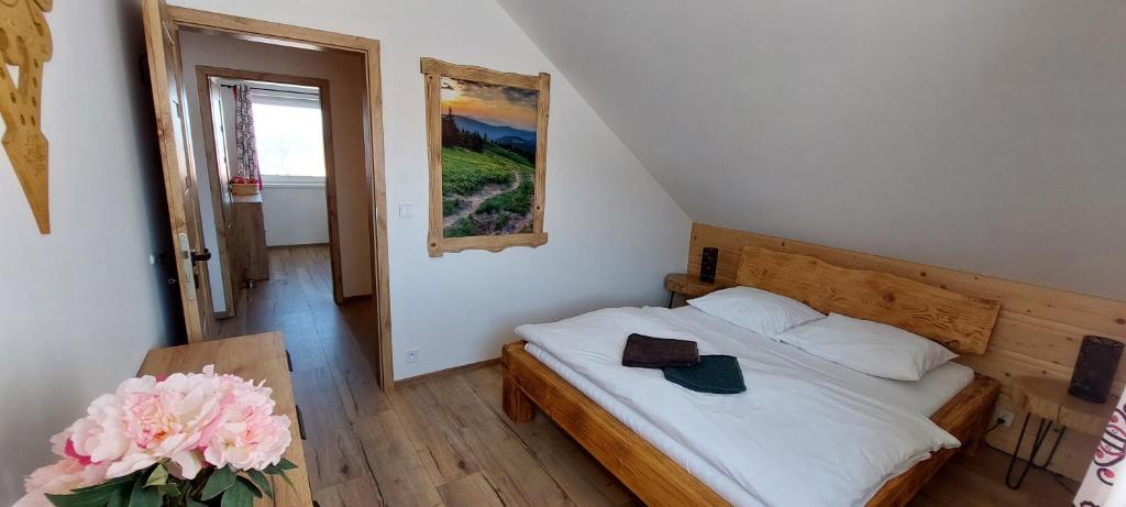 Postel nebo postele na pokoji v ubytování Rajderówka