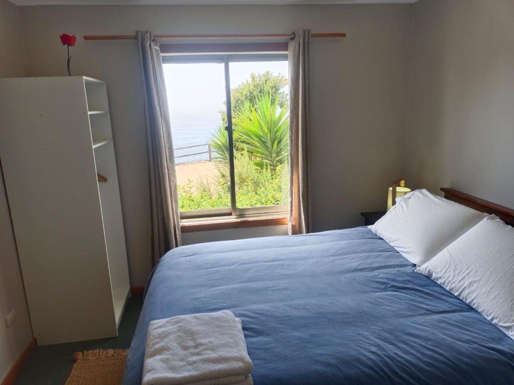 Postel nebo postele na pokoji v ubytování Hostal Quiriyuca Sur