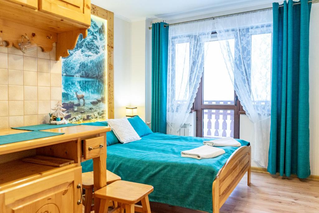 Кровать или кровати в номере Pokoje U Józi Sieczki