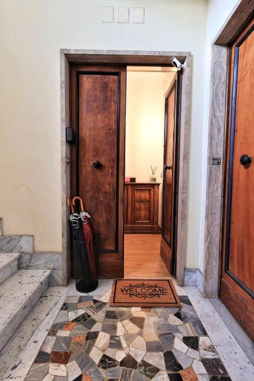 a hallway with a door and a tile floor at Flaminio Luxury Home - City Center in Rome