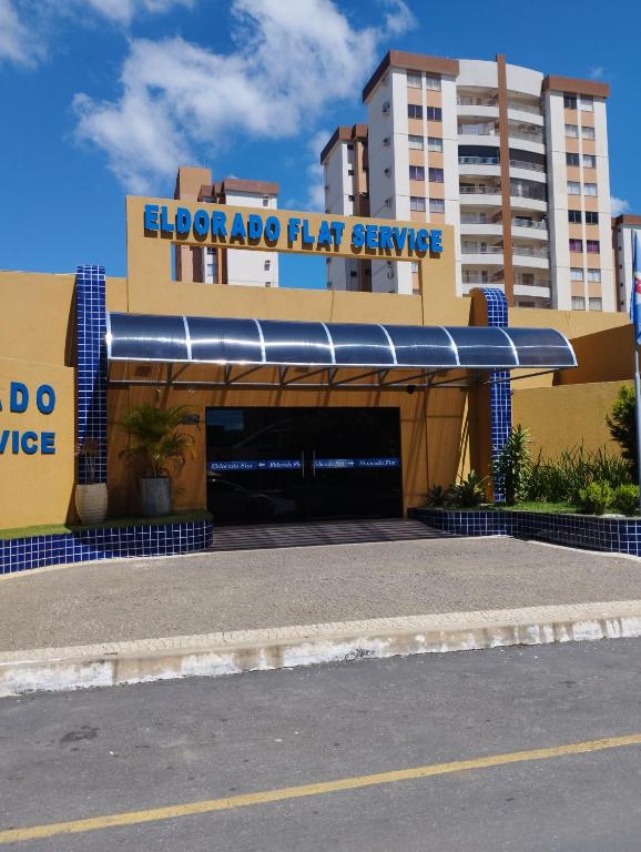 a building with a parking garage in front of it at Só alegria Eldorado Thermas in Caldas Novas