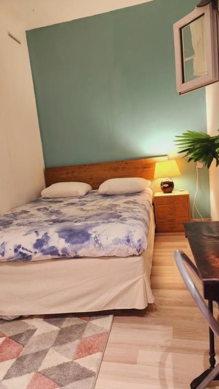 Katil atau katil-katil dalam bilik di Home Cosy ARENA Porte de la Chapelle