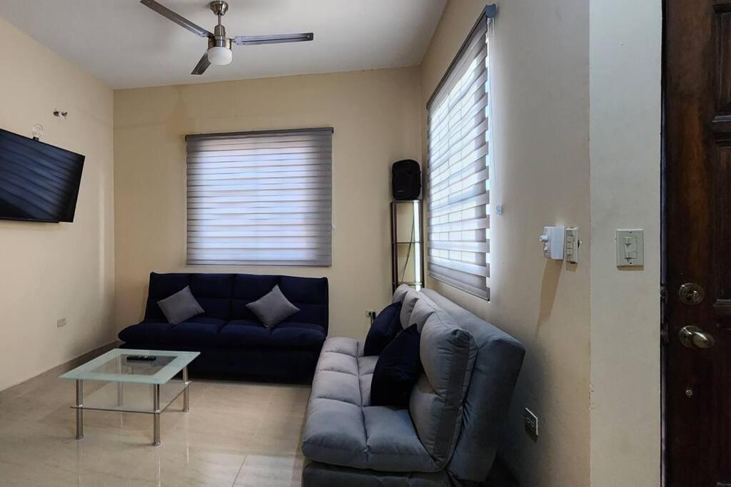 a living room with a couch and a table at Residencia Familiar en Ciudad Constitución B C S in Ciudad Constitución