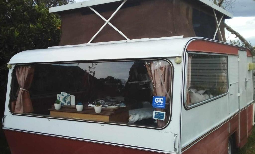 a white van with a table in the back of it at Blissful Rental in Motueka