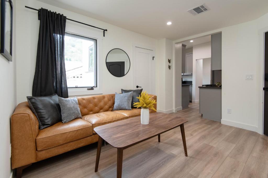 a living room with a couch and a table at Fun 5 Bedroom House Near DTLA in Los Angeles