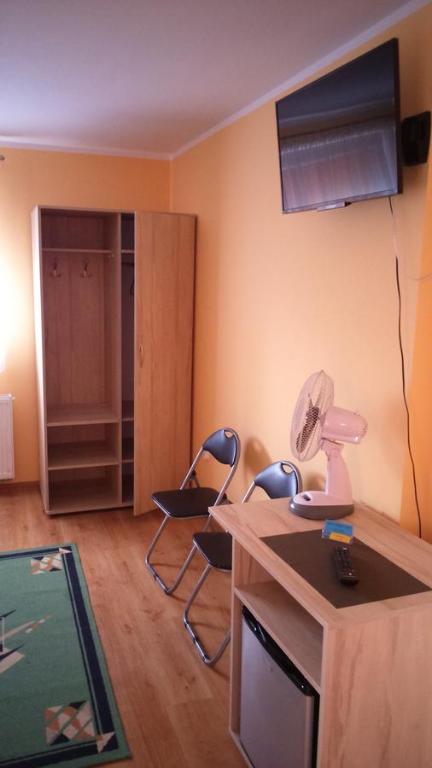 Televízia a/alebo spoločenská miestnosť v ubytovaní Pokoje Gościnne u Agaty