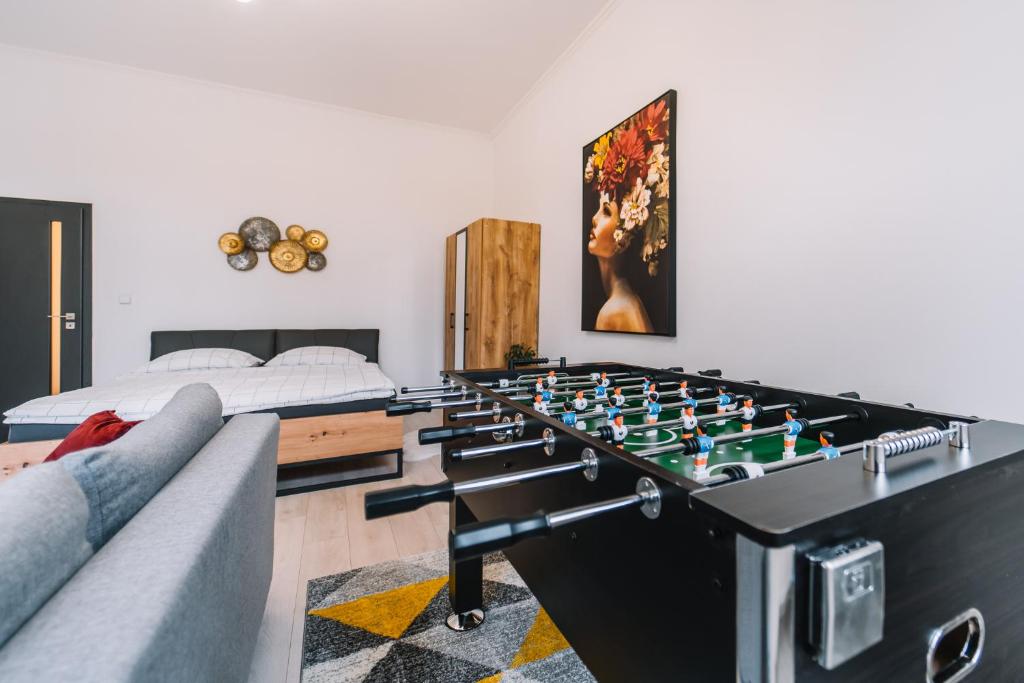 a living room with a large chess board at Modern living in city centre in Košice