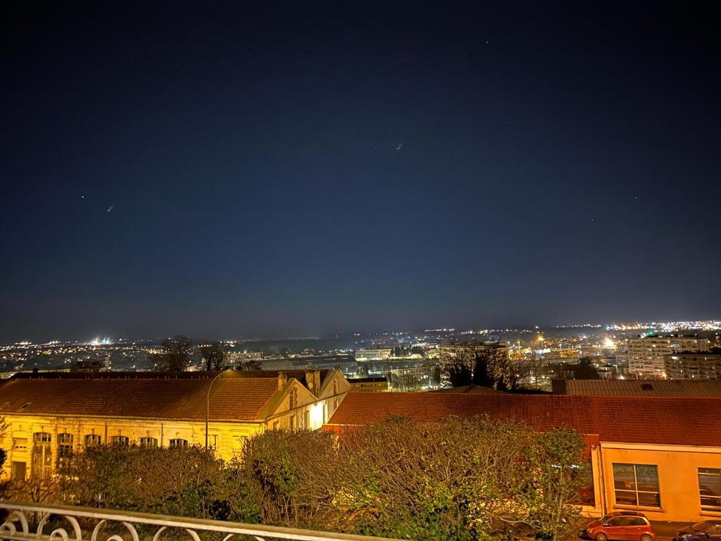 a view of a city at night with lights at Location saisonnière Angoulême in Angoulême