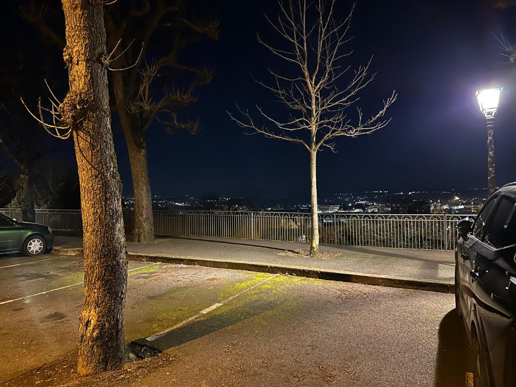 a parking lot at night with a street light at Location saisonnière Angoulême in Angoulême