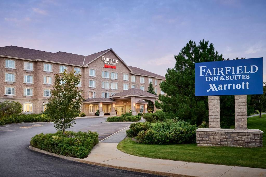 a hotel with a sign in front of a building at Fairfield Inn & Suites by Marriott Ottawa Kanata in Ottawa