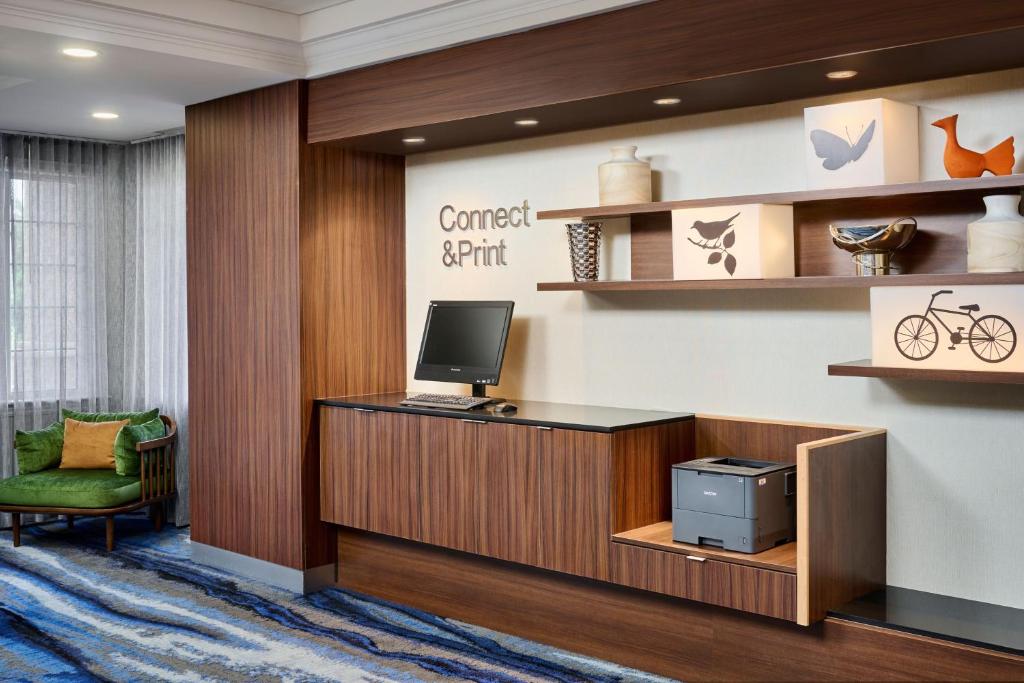 a lobby with a desk with a computer on it at Fairfield Inn & Suites by Marriott Ottawa Kanata in Ottawa
