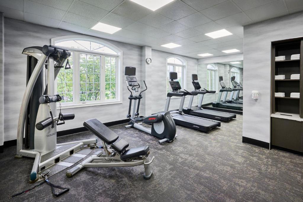 a gym with a row of treadmills and cardio machines at Fairfield Inn & Suites by Marriott Ottawa Kanata in Ottawa