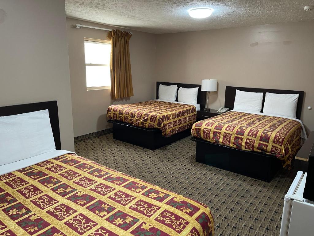 Economy Inn & Suites - Habitación Triple Económica