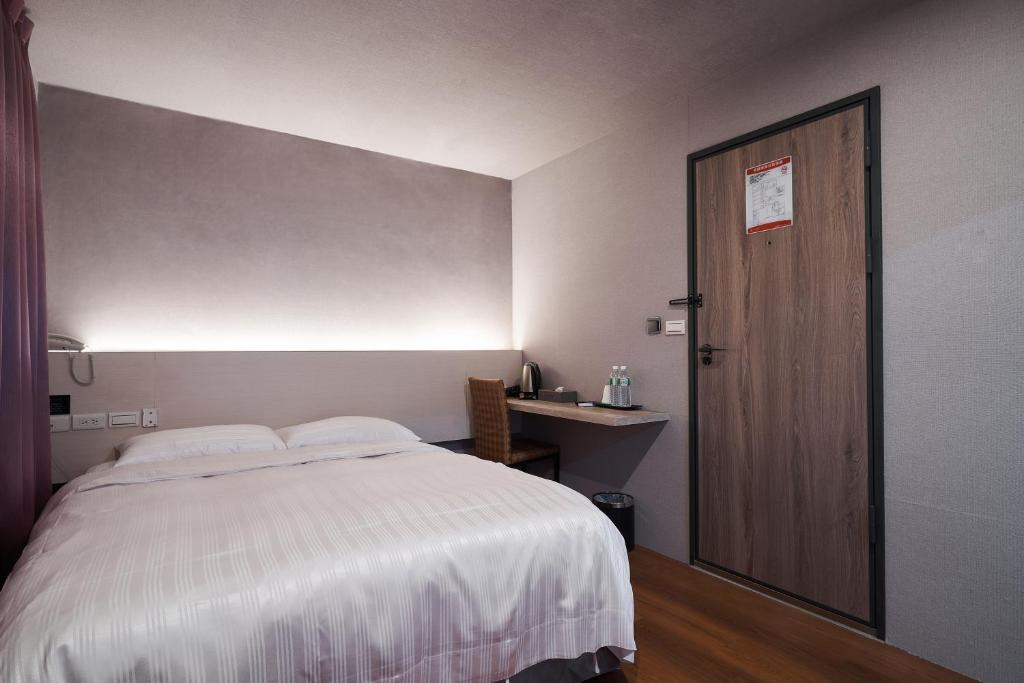 Yung An Business Hotel客房内的一张或多张床位