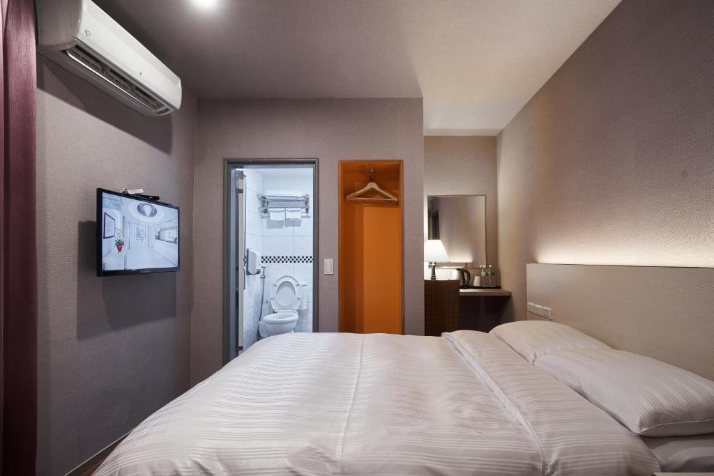 Yung An Business Hotel客房内的一张或多张床位