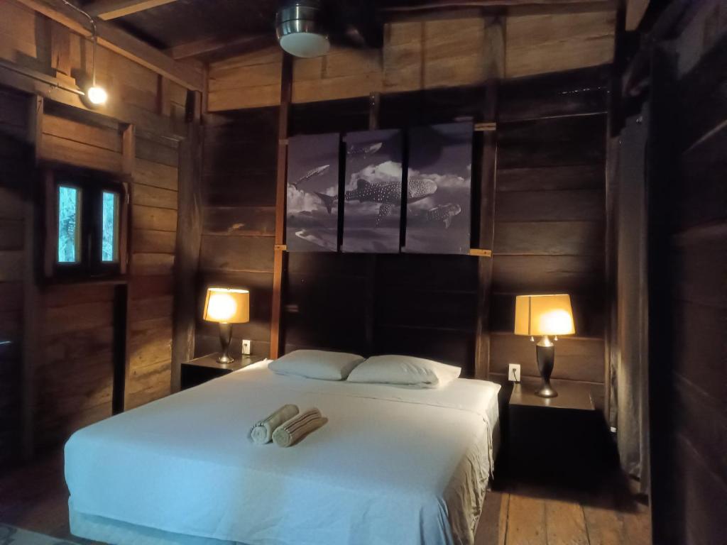 Postelja oz. postelje v sobi nastanitve Chéel lodge & Camping