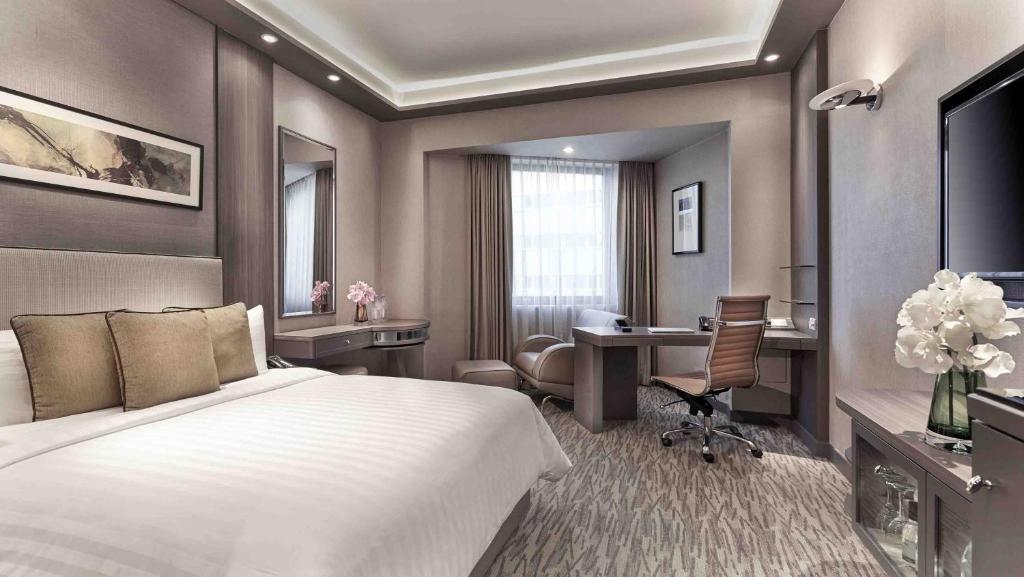 Giường trong phòng chung tại M Hotel Singapore City Centre