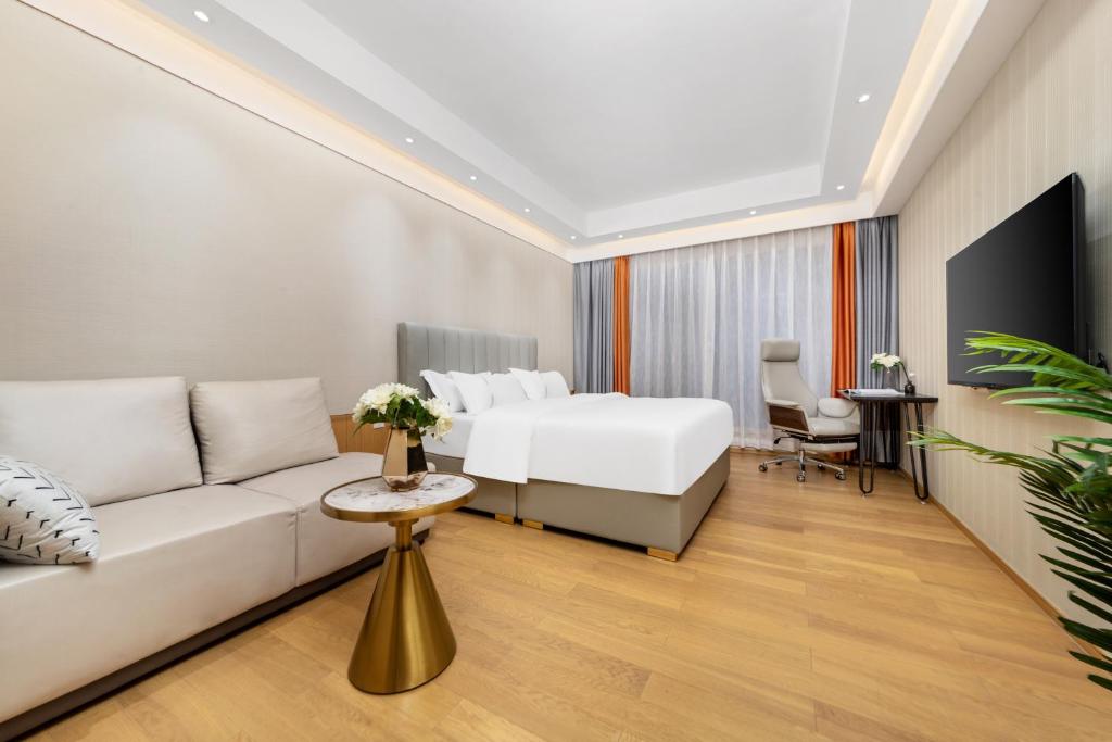 TV a/nebo společenská místnost v ubytování Doria Home International Apartment -Guangzhou Huijin IFC Keyun Road Metro Branch-Canton Fair Free Shuttle