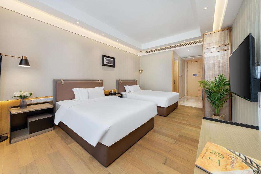 Postel nebo postele na pokoji v ubytování Doria Home International Apartment -Guangzhou Huijin IFC Keyun Road Metro Branch-Canton Fair Free Shuttle