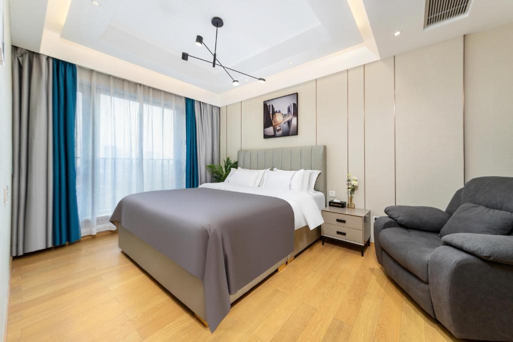 Postel nebo postele na pokoji v ubytování Doria Home International Apartment -Guangzhou Huijin IFC Keyun Road Metro Branch-Canton Fair Free Shuttle
