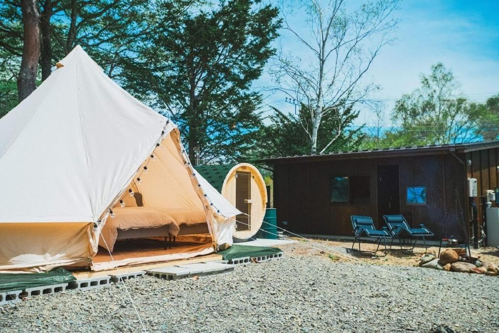 a large tent in front of a cabin at untitled - Vacation STAY 42157v in Hokuto