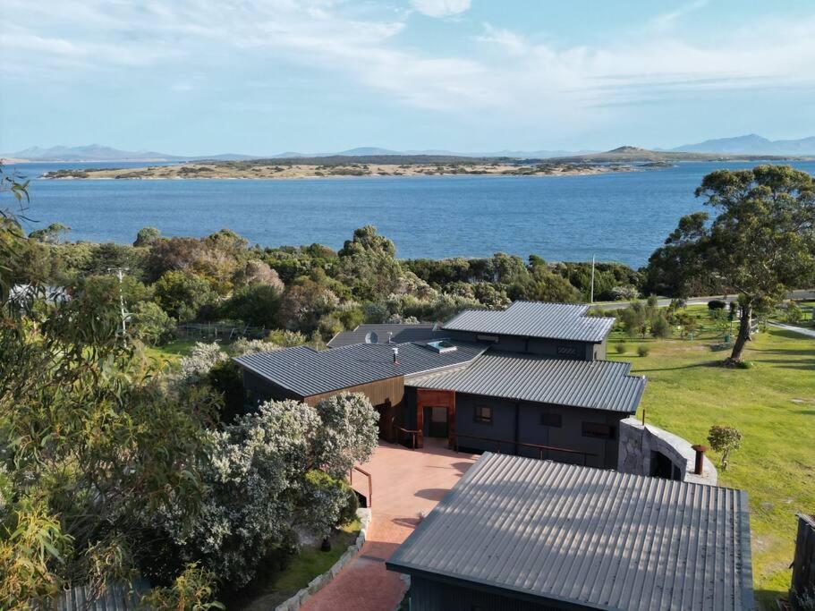 an aerial view of a house with a view of the water at Faraway on Flinders Island 