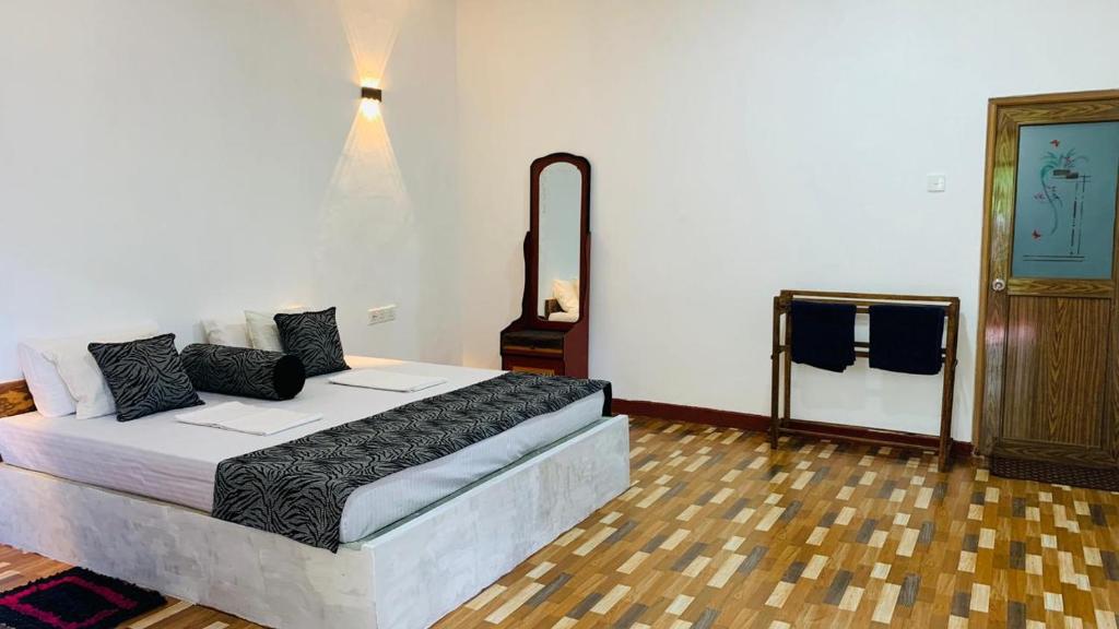 Postel nebo postele na pokoji v ubytování Sigiriya Chena Villa