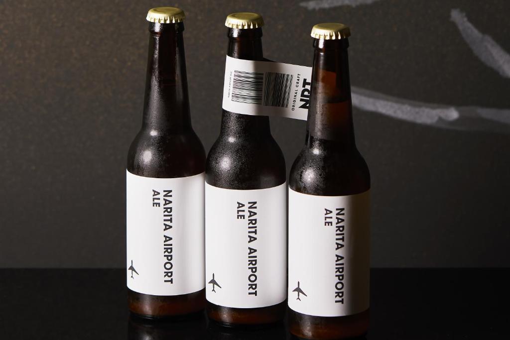 three bottles of beer sitting next to each other at Waqoo Naritasanmonzen in Narita