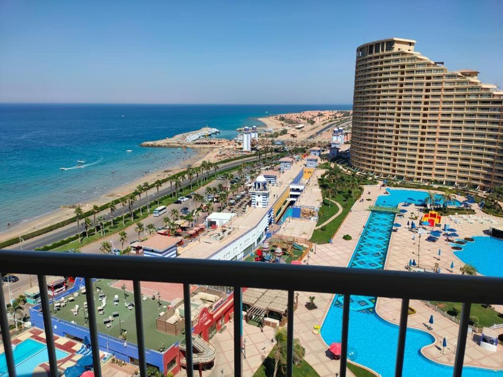 a view from a balcony of a resort and the ocean at Porto sokhna pyramids - family only in Ain Sokhna