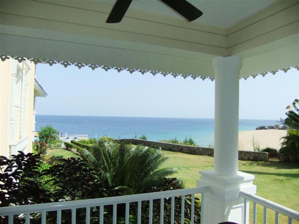a view of the ocean from the porch of a house at Los Balcones in Sosúa