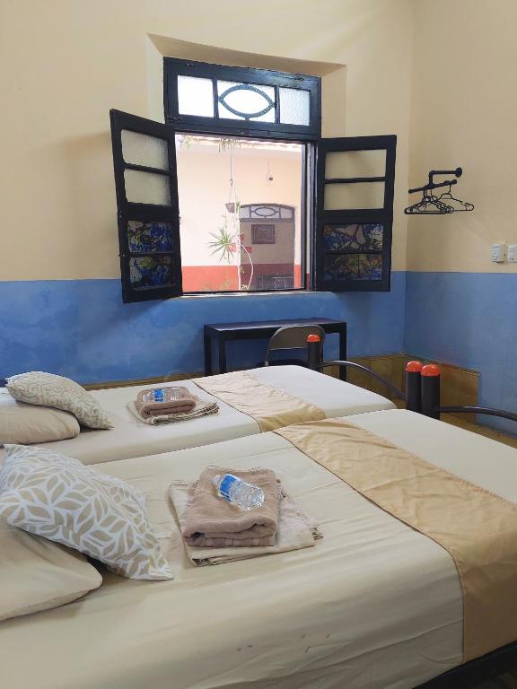 Una cama o camas en una habitación de Hostal La Ermita
