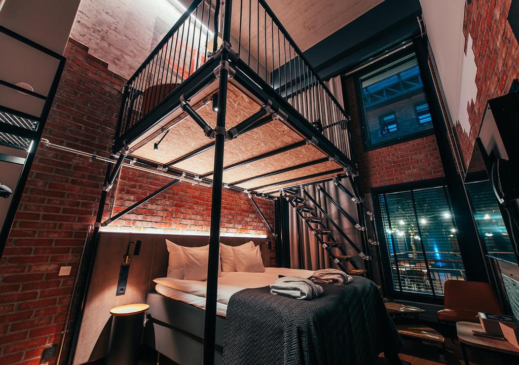 Postel nebo postele na pokoji v ubytování Clarion Hotel Mestari